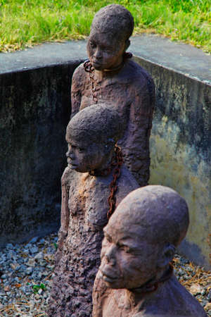 A statue in Stone Town, Zanzibar dipicting and mourning the African slave tradeの写真素材