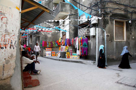 Stone Town, Zanzibar, Tanzania - January 1, 2016: People going about their daily business in Stone Town market, on the island of Zanzibarのeditorial素材