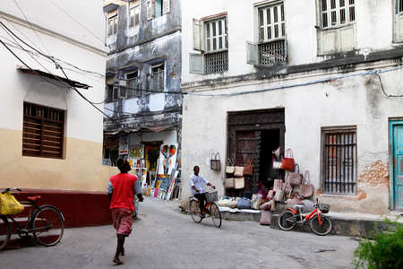 Stone Town, Zanzibar, Tanzania - January 1, 2016: People going about their daily business in Stone Town market, on the island of Zanzibarのeditorial素材