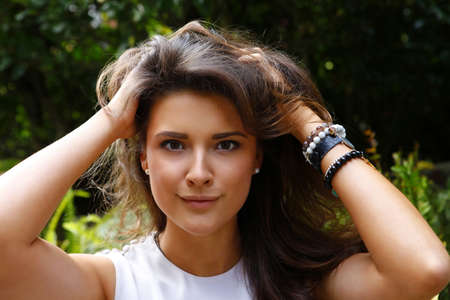 Portrait of a beautiful brunette outdoorsの写真素材