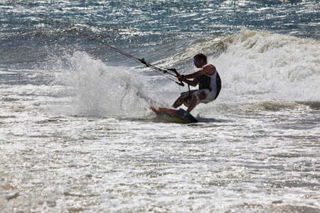 Kiteboarder enjoy surfing in ocean. Vietnamの写真素材