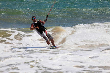 Kiteboarder enjoy surfing in ocean. Vietnamの写真素材
