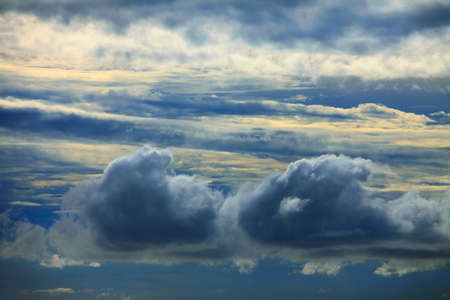 Clouds before a thunder-storm. A view from a window of the planeの写真素材