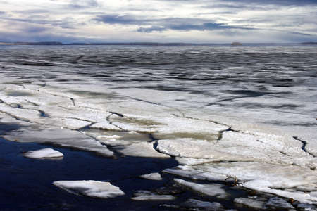 Melting ice on the river in the springの写真素材