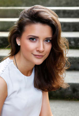 Portrait of a beautiful brunette outdoorsの写真素材