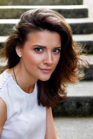 Portrait of a beautiful brunette outdoorsの写真素材