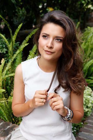 Portrait of a beautiful brunette outdoorsの写真素材