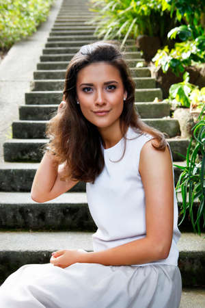 Portrait of a beautiful brunette outdoorsの写真素材