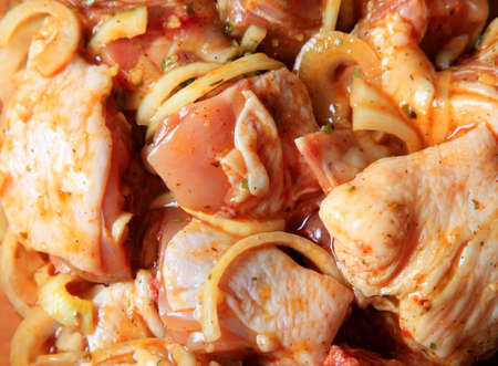 Pieces of raw chicken in sauce with vegetables marinated barbecueの写真素材