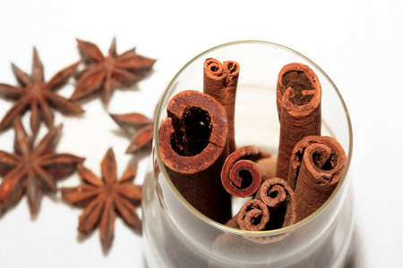 anice and cinnamon isolated on white backgroundの写真素材