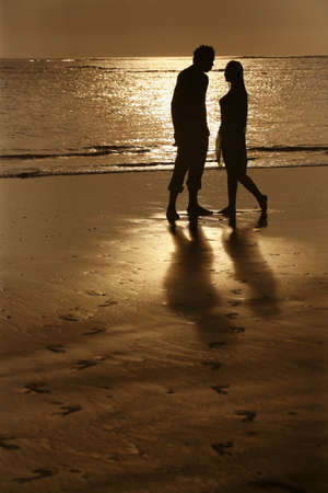Couple on sunset. Coast of the Indian oceanの写真素材