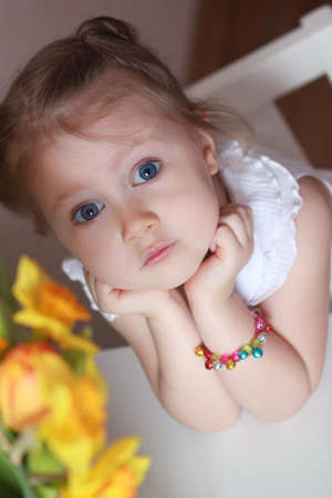 Beautiful small kid girl in studioの写真素材