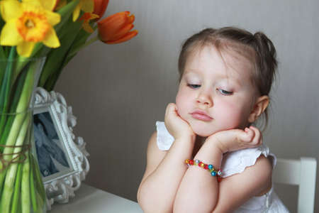 Beautiful small kid girl in studioの写真素材