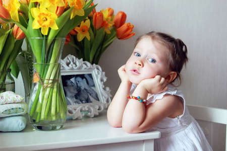 Beautiful small kid girl in studioの写真素材