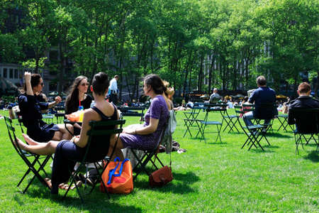 York City, NY, USA - May 16, 2013: People enjoying a nice day in Bryant Park on May 16, 2013 in New York City, NY. Bryant Park is a 9,603 acre privately managed park in the center of Manhattan.のeditorial素材