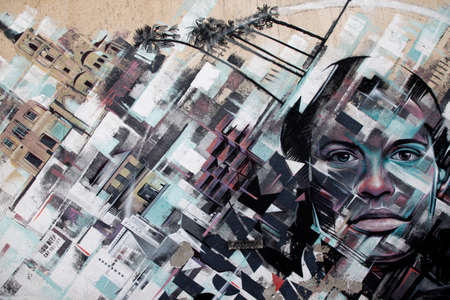 Larnaca, Cyprus - May 23, 2016: Graffiti with the image of the city and faces on the wall as a background in Larnaca, Cyprusのeditorial素材