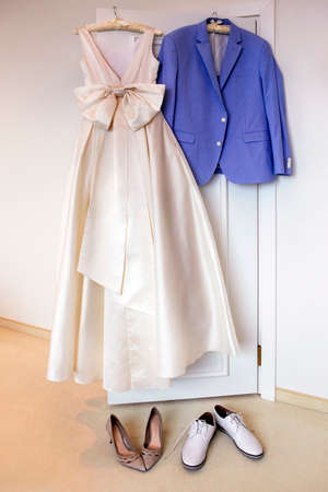Wedding accessories - dress for the bride, for the groom jacket and beautiful shoesの写真素材