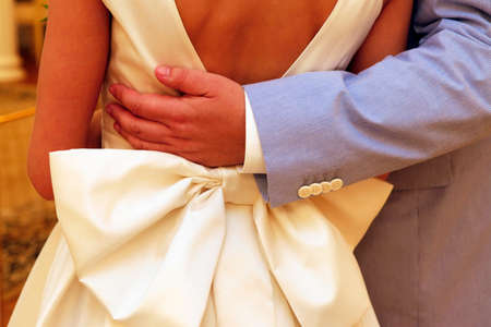 Groom embracing his brideの写真素材