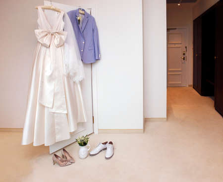 Wedding accessories - dress for the bride, for the groom jacket and beautiful shoesの写真素材