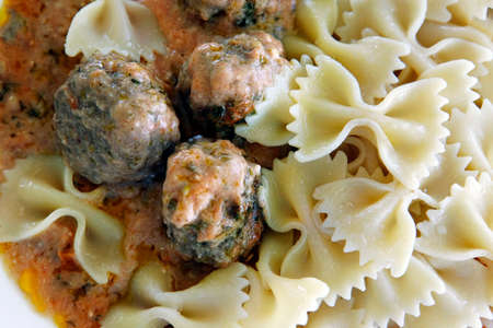 Small meat balls with pasta and red sauceの写真素材