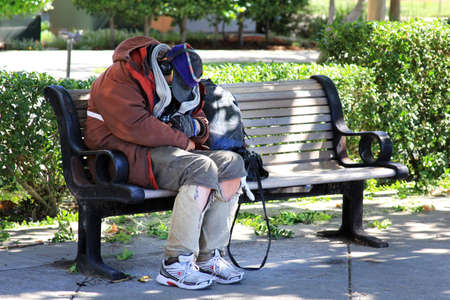 San Francisco, CA, USA - September 26, 2013: Homeless man sleeps on the street in the center of San Franciscoのeditorial素材