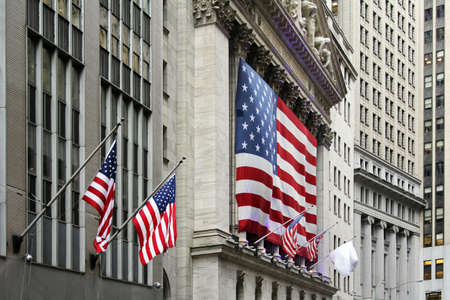Wall Street with New York Stock Exchange in Manhattan Finance district during United States economy recovery in Manhattan. New York City.の写真素材