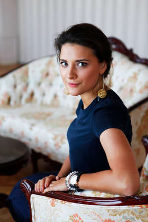 Portrait of a beautiful brunette intdoorsの写真素材