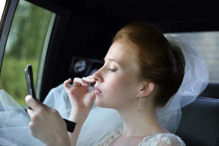 The beautiful bride in the automobileの写真素材