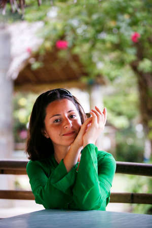 Portrait of young brunette in the parkの写真素材
