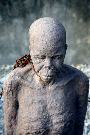 A statue in Stone Town. Zanzibar dipicting and mourning the African slave tradeのeditorial素材