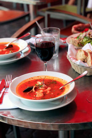 Bowl of spicy fish soup with tomatoes and musselsの写真素材