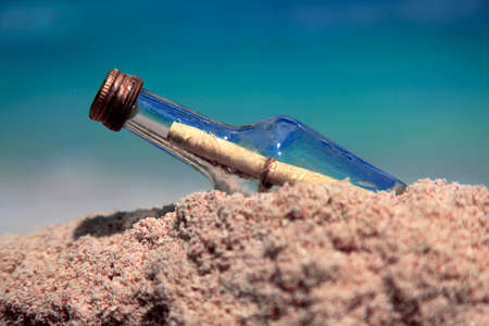 Message in the bottle on sand beachの写真素材