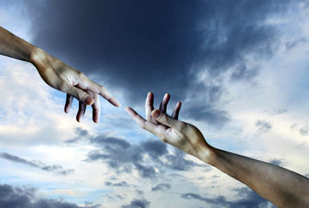 Men's hands on a sky backgroundの写真素材