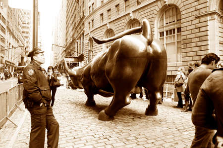 New York City, NY, USA ? October 09, 2012: The Bronze Green Park in Lower Manhattan. Made by maestro Arturo Di Modica, an urban legend and now, an international icon. The statue attracts many tourists who want to be photographed with the bull.のeditorial素材
