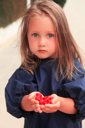 Little girl laughing on streetの写真素材