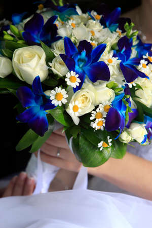The bride holds a wedding bouquetの写真素材