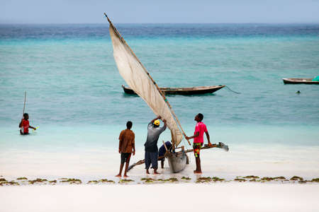Stone Town (Zanzibar), Tanzania - January 9, 2016: A dhow (traditional sailboat) in the background...