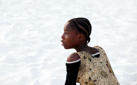 Zanzibar, Tanzania - January 9, 2016: Surprised African teen girl on the Nungvi beach, Tanzaniaのeditorial素材
