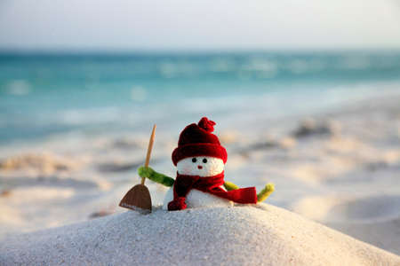 Toy of the snowman on beach backgroundの写真素材