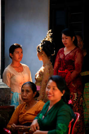 Ubud,Bali, Indonesia - October 31, 2010: In Bali, Young Indonesian bride is surrounded by her relatives before the wedding ceremonyのeditorial素材