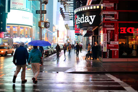 New York, USA - May 20, 2013: Time Square at night in the rain. The site is regarded as the world's most visited tourist attraction with nearly 40 million visitors annually.のeditorial素材