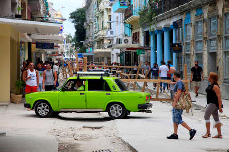 Havana, Ð¡uba - January 10, 2019: Vintage cars moving on the streets of colorful Havana. A great variety of old cars exist In Cuba. On the streets cars from the first half of the 20th century can be found in magnificent conditions, which takes back in hisのeditorial素材