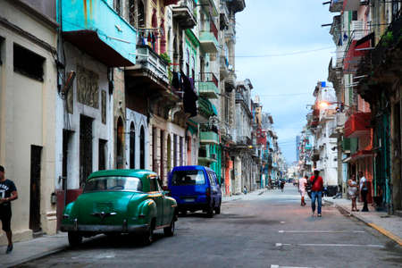 Havana, Cuba - January 10, 2019: Vintage cars moving on the streets of colorful Havana. A great variety of old cars exist In Cuba. On the streets cars from the first half of the 20th century can be found in magnificent conditions, which takes back in histのeditorial素材