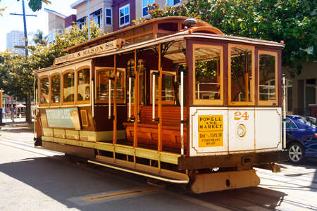 SAN FRANCISCO, CA, USA - AUGUST 17, 2013: Passengers ride in a cable car on August 17, 2013 in San Francisco. It is the most popular way to get around the City of San Fransisco which is in service since 1873.のeditorial素材