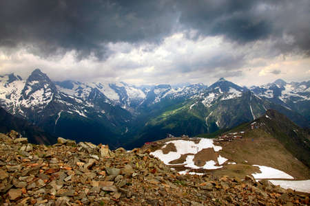 Panorama of mountains scene with dramatic blue sky in national park of Dombayの写真素材