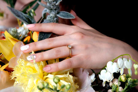 The bride holds a wedding bouquetの写真素材