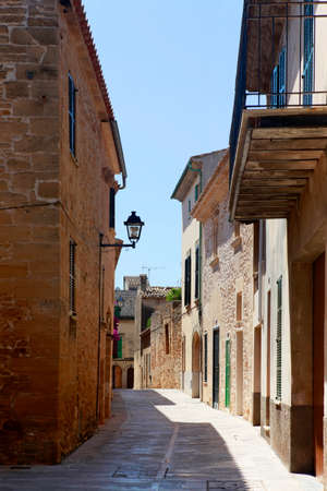 The narrow street in the old town of Alcudia, Mallorcaの写真素材