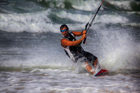 Kiteboarder enjoy surfing in ocean. Vietnamの写真素材