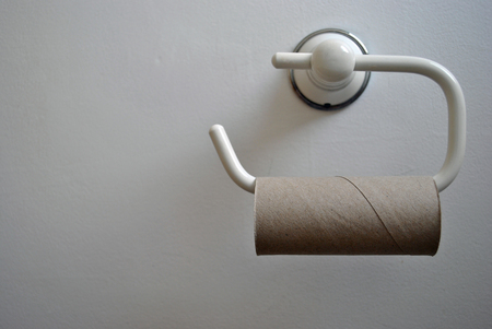 emergency of an empty toiletpaper roll on the rail の写真素材