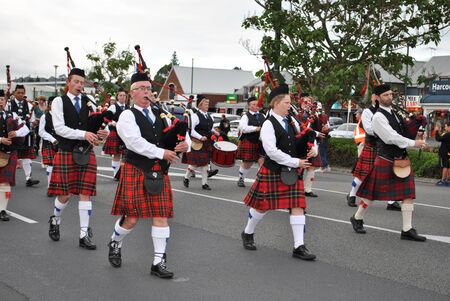 scottish band marching through the street at kumeu new zealand christmas paradeのeditorial素材